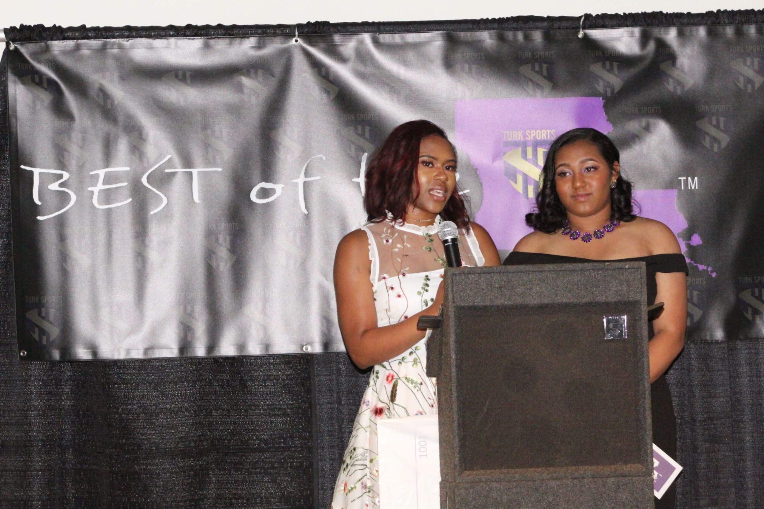 Hailey King & Amari Hurst present the award best defensive athlete- Football