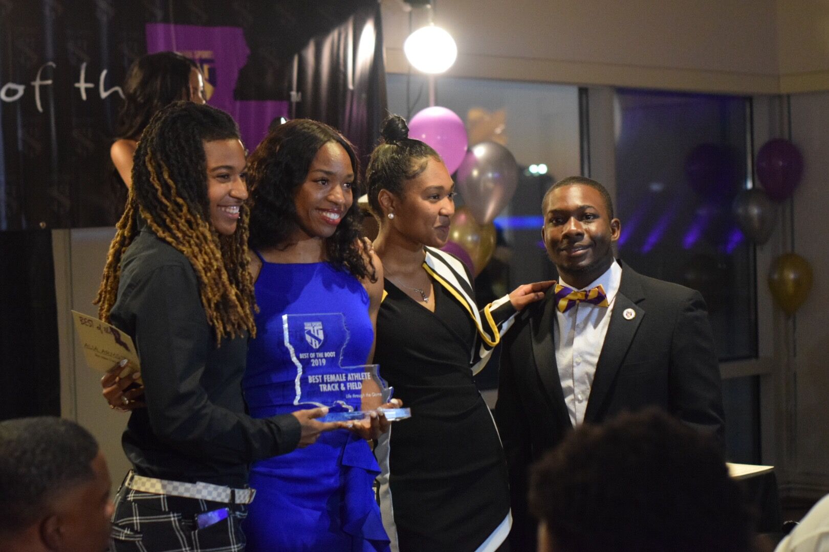 Alia Armstrong- Best Female Athlete; Track & Field receives award from Pro Track Star Aliah Hobbs, presenter Amaya Cannon & Lance Jones